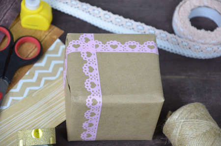 Top view of table with elements for scrapbooking, tools for decoration and handmade albums and cards. Craft materials. hobby. a gift for St. Valentine's Day. heart shapeの写真素材