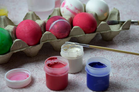 Colorful handmade easter eggs balls with paint and bruch. craft, home made decorations for easterの写真素材