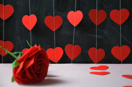 Red roses with hearts on a old wooden table, valentines dayの写真素材