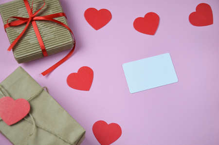 blank Valentines day greeting or gift card and gift box, heart. Top view with copy space