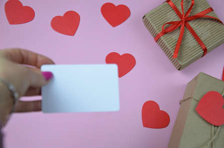 blank Valentines day greeting or gift card and gift box, heart. Top view with copy spaceの写真素材