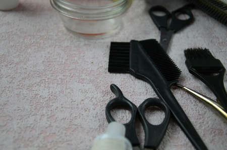hairdresser Accessories for coloring hair on a pink backgroundの写真素材