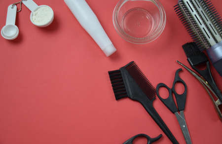 hairdresser Accessories for coloring hair on a pink backgroundの写真素材