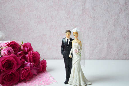 wedding shoes and wedding bouquet of white rosesの写真素材