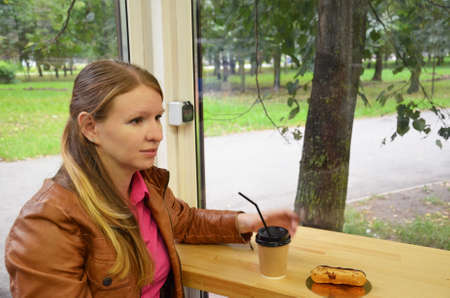 Beautiful young women drinking tea in restaurantの写真素材