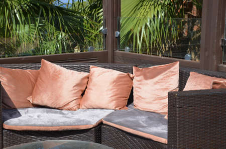 empty table in a summer street cafe overlooking the sea, palm trees. The concept of rest, vacation, summerの写真素材