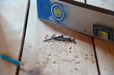 Hexagon screws on a wooden floor. tool to repair service, build, woodworking instrument