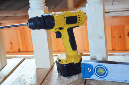 Hexagon screws on a wooden floor. tool to repair service, build, woodworking instrumentの写真素材