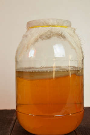 fermented drink, jun tea healthy natural probiotic in a glass jar.の写真素材