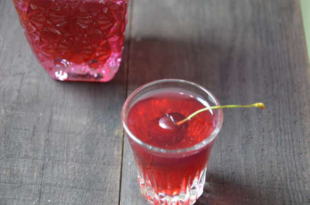 Cherry Drink Mulled Wine, horizontal, selective focus. cherry alcohol tincture. liquor.の写真素材