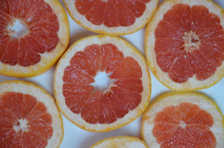 Beautiful fresh sliced mixed citrus fruits like background, concept of healthy eating, dieting, top viewの写真素材