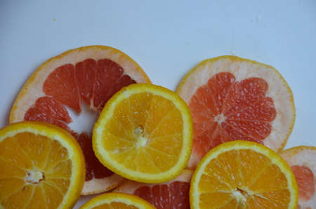 beautiful fresh sliced mixed citrus fruits like background, concept of healthy eating, dieting, top viewの写真素材