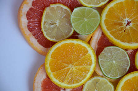 beautiful fresh sliced mixed citrus fruits like background, concept of healthy eating, dieting, top viewの写真素材