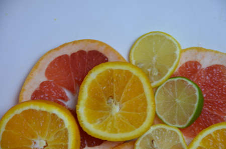 beautiful fresh sliced mixed citrus fruits like background, concept of healthy eating, dieting, top viewの写真素材