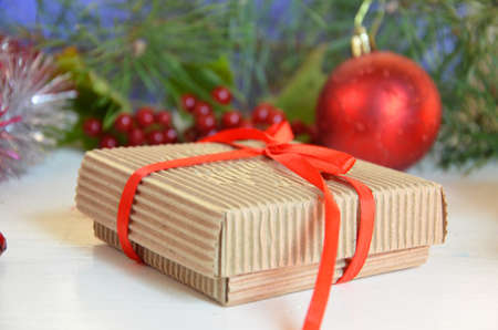Christmas decorations. Holly, spruce, red berries, christmas bauble, conifer cone.の写真素材