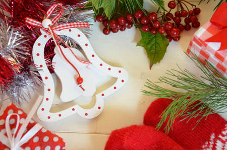 Christmas border. Christmas gifts, fir branches on wooden white background. Flat lay, top view, copy spaceの写真素材