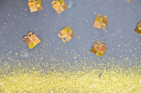 Abstract black background with golden serpentine, stars, gifts, Christmas tree for Christmas or New...