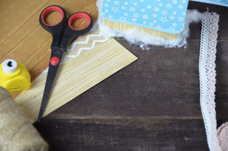 Making a scrap booking birthday card/Scrapbook, Button, Craft, Adult, Art. Sly paper, scissors, knife, for making hand maid postcard, box, for valentine day, mother's day, Easter. Scrapbooking hobbyの写真素材