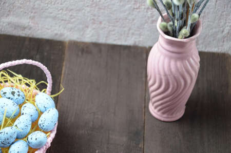Easter background with willow branches and eggs.