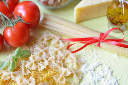 composition of healthy food ingredients on yellow white background, top view. Ingredients for making...