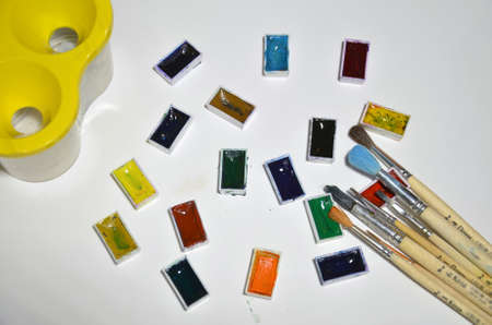 Paints and brushes on the white background.の写真素材