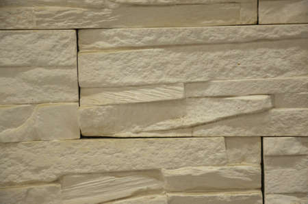 Marble brick stone tile wall texture background in light beige yellow cream colorの写真素材