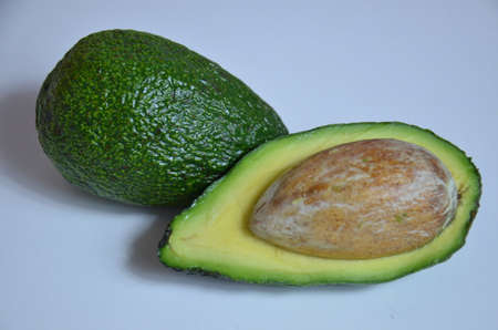 Natural organic ripe avocado. Half avocado on white background. Isolated. Top view.の写真素材