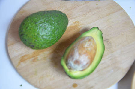 Natural organic ripe avocado. Half avocado on white background. Isolated. Top view.の写真素材