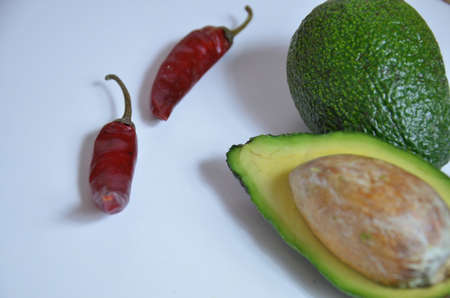 Natural organic ripe avocado. Half avocado on white background. Isolated. Top view.の写真素材