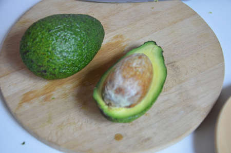 Natural organic ripe avocado. Half avocado on white background. Isolated. Top view.の写真素材
