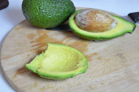 Natural organic ripe avocado. Half avocado on white background. Isolated. Top view.の写真素材