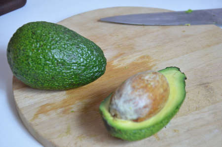 Natural organic ripe avocado. Half avocado on white background. Isolated. Top view.の写真素材