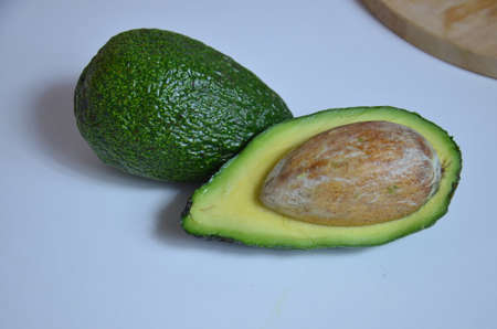 Natural organic ripe avocado. Half avocado on white background. Isolated. Top view.の写真素材
