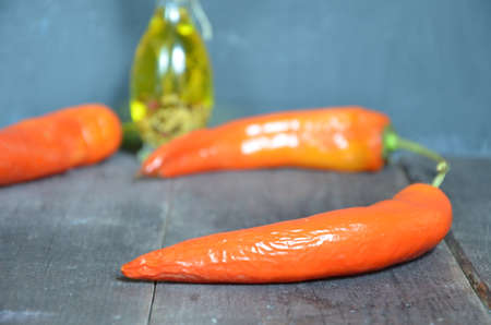 Red hot chili peppers and garlic, on dark wooden background. copy space top viewの写真素材