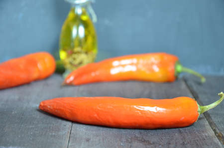 Red hot chili peppers and garlic, on dark wooden background. copy space top viewの写真素材