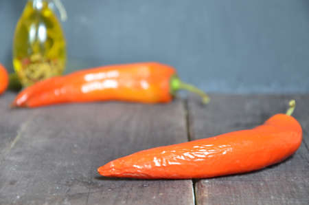 Red hot chili peppers and garlic, on dark wooden background. copy space top viewの写真素材