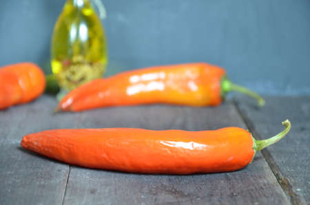 Red hot chili peppers and garlic, on dark wooden background. copy space top viewの写真素材
