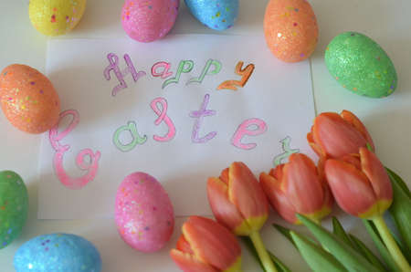 Happy Easter Day. Easter eggs concept. Closeup Colorful Easter eggs in nest and basket green gress...