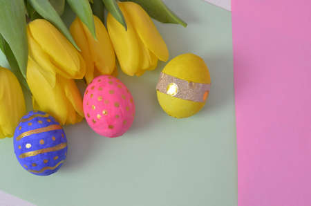 Easter eggs lying in a basket. Inscription Happy Easter. Space for text. Selected focus.の写真素材
