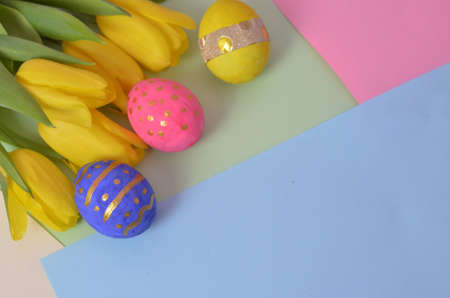 Easter eggs lying in a basket. Inscription Happy Easter. Space for text. Selected focus.の写真素材