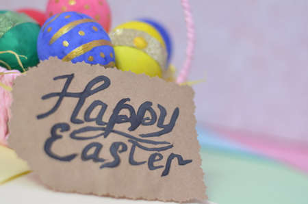 Easter, Easter egg color vibrant, spring Orthodox holiday. colorful decorated eggs in a pink basket on a background of different colorsの写真素材