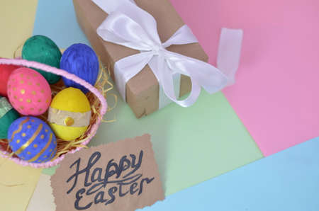 Easter, Easter egg color vibrant, spring Orthodox holiday. colorful decorated eggs in a pink basket on a background of different colorsの写真素材