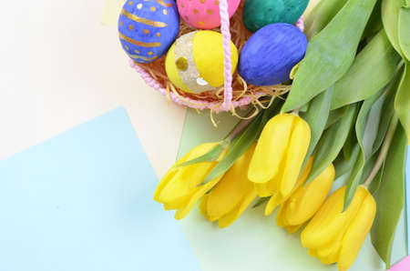 Easter eggs lying in a basket. Inscription Happy Easter. Space for text. Selected focus.