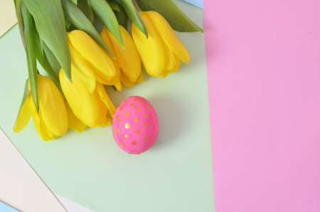 Easter eggs lying in a basket. Inscription Happy Easter. Space for text. Selected focus.