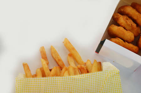chicken nuggets and french fries on white background, takeaway food, to go.の写真素材