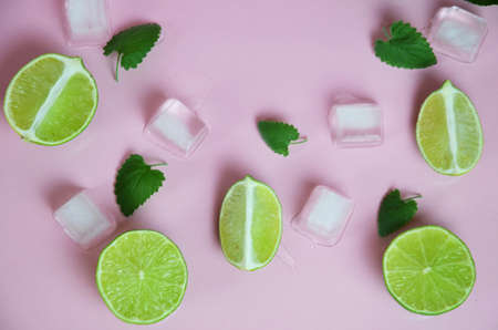 Mint, lime, ice, ingredients and bar utensils for making mojito cocktail on pink background. top view. to make a drink of lemonade, cold iced tea, a cocktail, mojito, detox. Texture Patternの写真素材