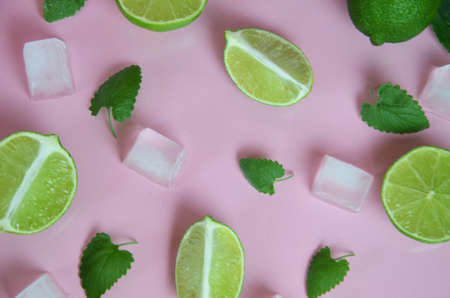 Mint, lime, ice, ingredients and bar utensils for making mojito cocktail on pink background. top view. to make a drink of lemonade, cold iced tea, a cocktail, mojito, detox. Texture Patternの写真素材