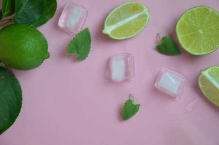 Mint, lime, ice, ingredients and bar utensils for making mojito cocktail on pink background. top view. to make a drink of lemonade, cold iced tea, a cocktail, mojito, detox. Texture Patternの写真素材