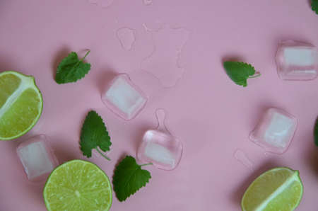 Mint, lime, ice, ingredients and bar utensils for making mojito cocktail on pink background. top view. to make a drink of lemonade, cold iced tea, a cocktail, mojito, detox. Texture Patternの写真素材