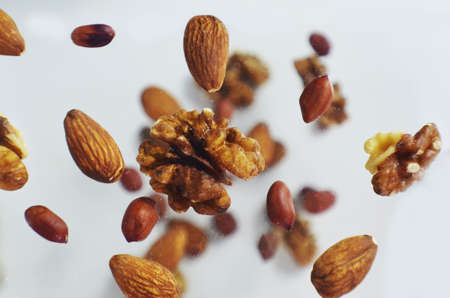 Nuts in the air on a white background, flying nuts. Healthy Brain Food, Diet, Protein, Almonds, walnuts and hazelnuts peanutの写真素材